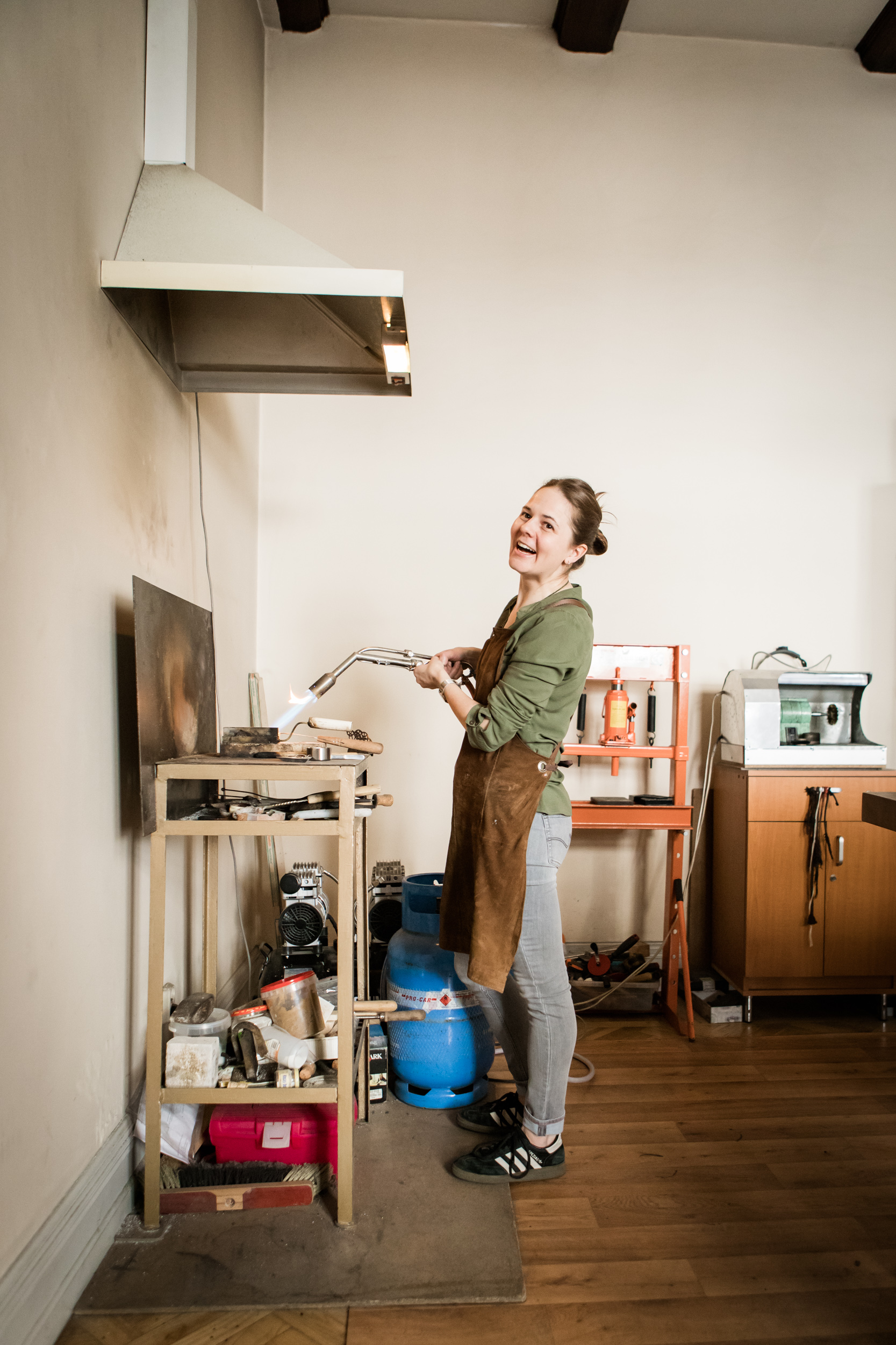 Melting silver in a crucible. Before working on a jewelry, Magda is melting the object to reshape it later.