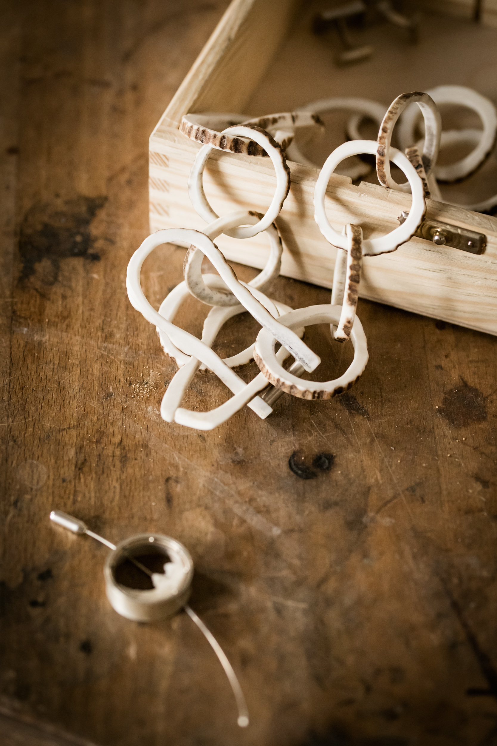 Necklace from deer’s antlers and a brooch from cat’s jaw.