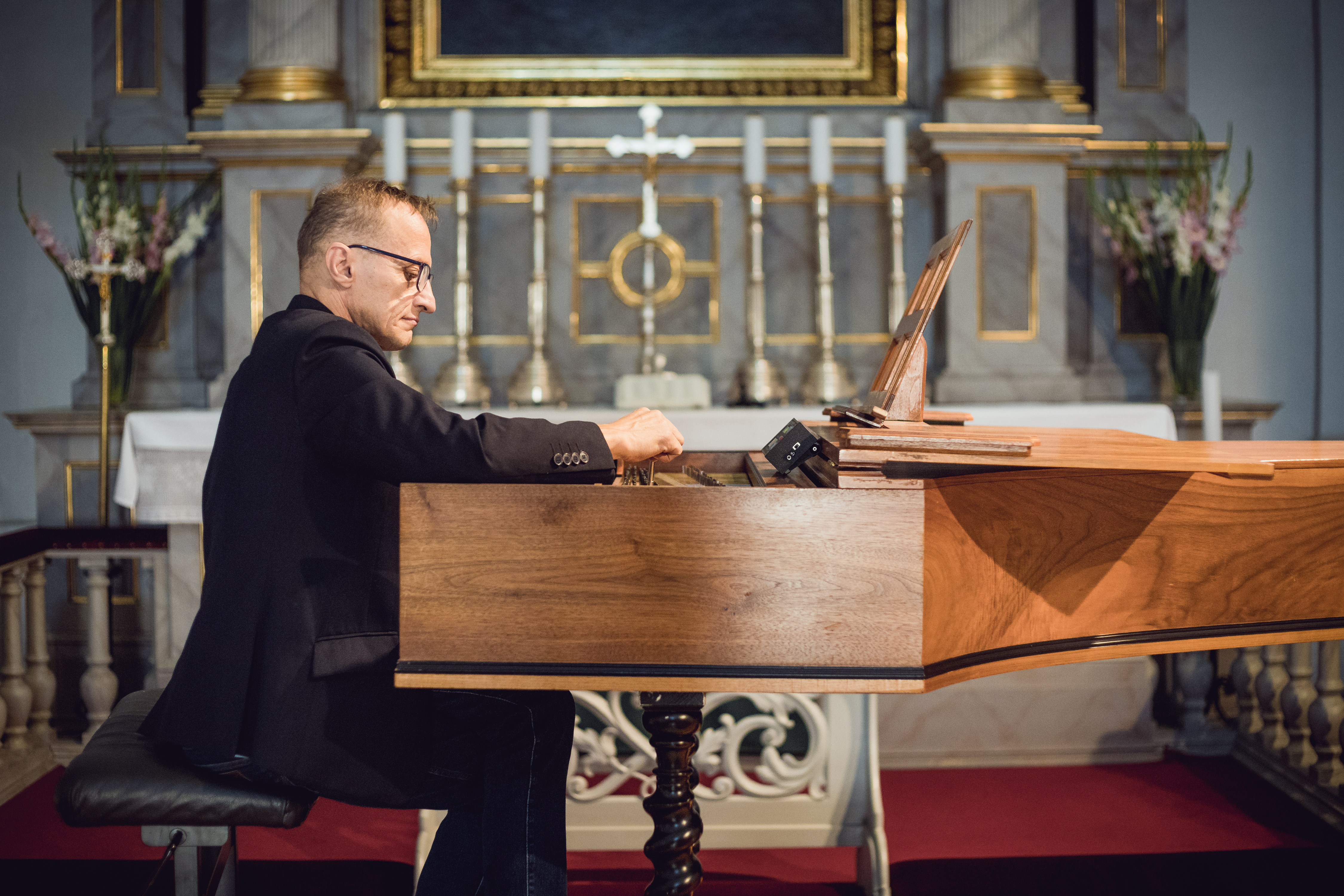 Mr Witold tuning the harpsichord.